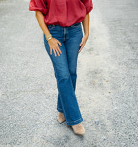Daze Denim Heartbreaker Mid Rise Flare Jean in Influencer